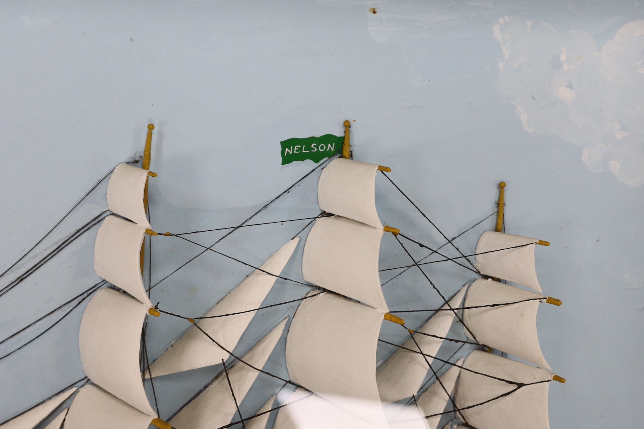 A painted half ship diorama, Perspex glazed frame (Nelson), 52x92cm total
